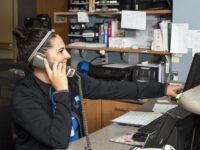 Michigan OBGYN on a phone at a Michigan Birthing Center. Michigan Obstetrics and Gynecology.