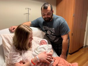 Jan1Baby Parents with newborn New Year's baby
