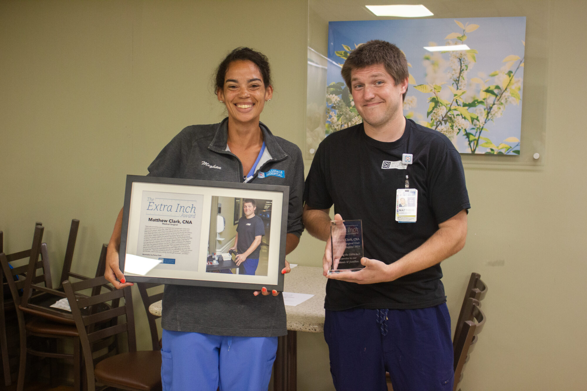 Chief Nursing Officer Meghan Campbell presents Extra Inch Award to Matthew Clark, CNA