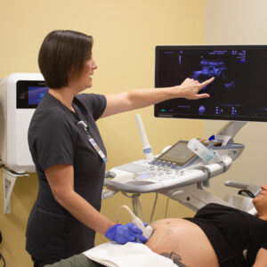 Extra Inch Award Winner Christine Monroe performing ultrasound