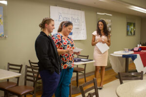 Kamryn Gittings, Brandi Revers and CNO Meghan Campbell at Extra Inch Award ceremony