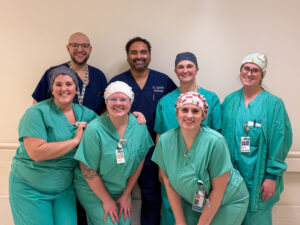 Hillsdale Hospital Surgical Team (Top row, L to R: William Morgan, DO; Amritraj Loganathan, MD, FAANS; Nicole Salloum, PA-C; Emily Mackie, RN; Bottom row, L to R: Jessica Sorrell, certified surgical technologist; Jordan Gonshorowski, certified surgical technologist; Sophie Hodos, certified surgical technologist)